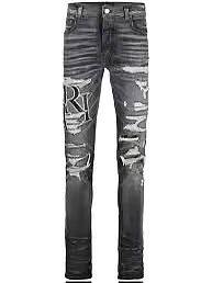 Amiri logo-print ripped jeans - 1