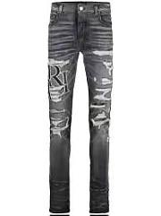 Amiri logo-print ripped jeans - 1