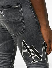 Amiri logo-print ripped jeans - 2